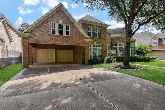 3211 Riviera Dr, Sugar Land, TX 77479 - traditional-style home featuring brick siding, a front lawn, concrete driveway, and a garage