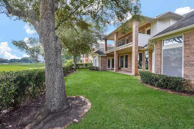 3211 Riviera Dr, Sugar Land, TX 77479 - view of yard featuring a ceiling fan, a balcony, and french doors
