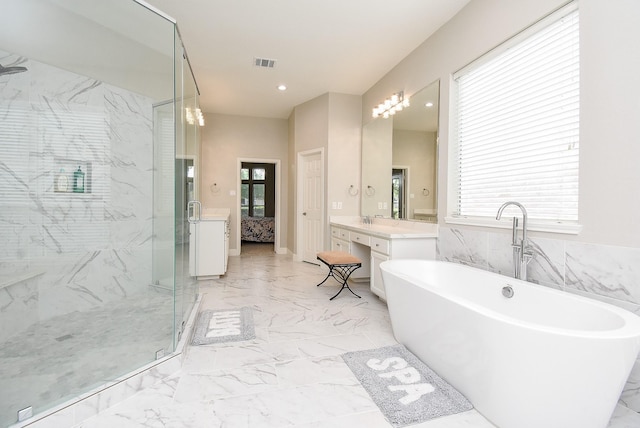 3211 Riviera Dr, Sugar Land, TX 77479 - bathroom with a wealth of natural light, visible vents, marble finish floor, a shower stall, and a soaking tub