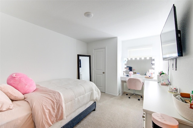 carpeted bedroom with baseboards