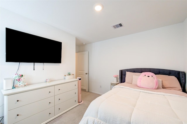 bedroom featuring light colored carpet, visible vents, and baseboards