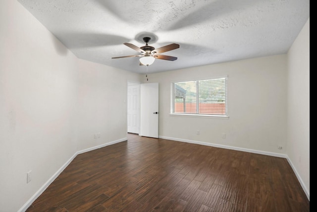 unfurnished room with dark wood finished floors, a textured ceiling, baseboards, and ceiling fan