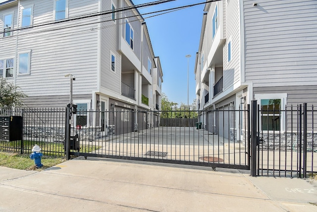 view of gate featuring fence