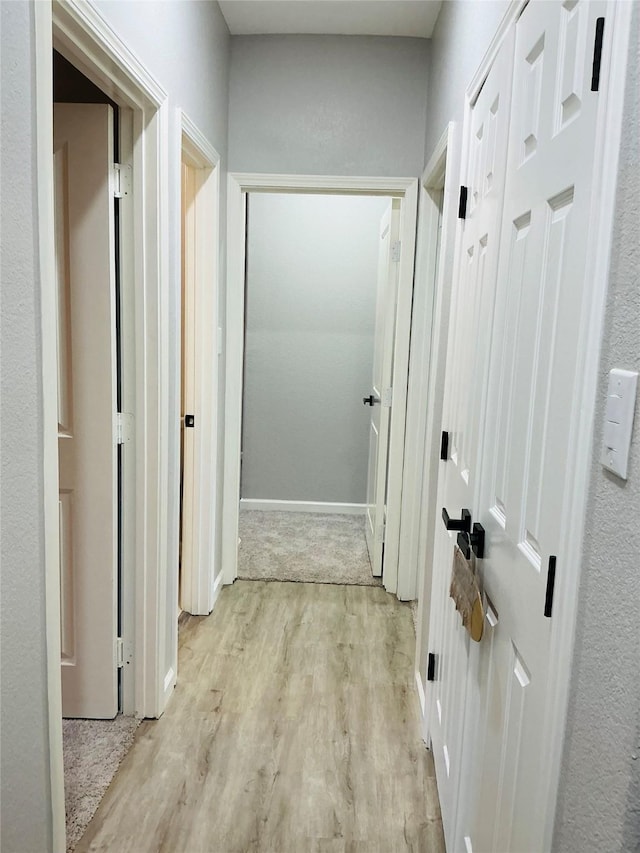 corridor featuring light wood-type flooring