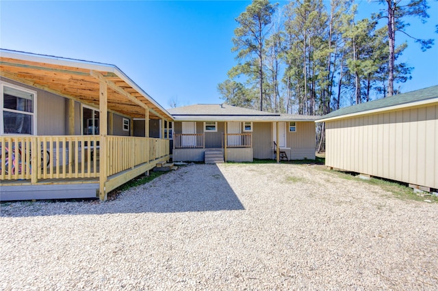 back of property featuring a porch