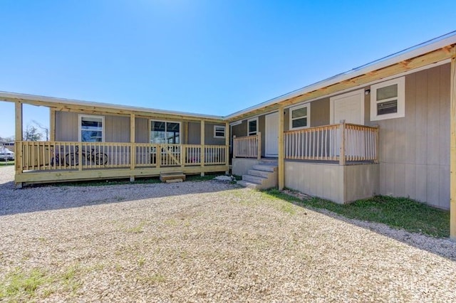 back of property featuring a porch