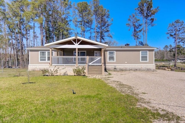 view of front of home with a porch and a front lawn