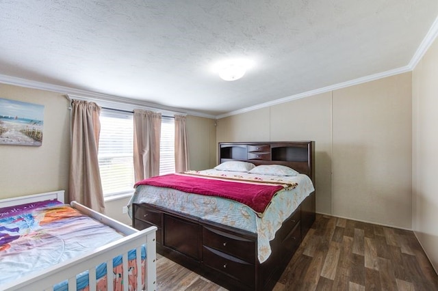 bedroom with a textured ceiling, crown molding, and wood finished floors