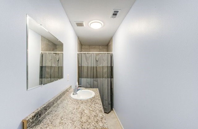 full bathroom with tile patterned flooring, a shower with curtain, vanity, and visible vents