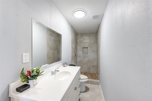 full bathroom with visible vents, vanity, toilet, and a shower stall