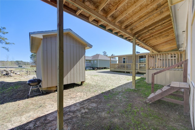 view of yard with an outdoor structure and a deck