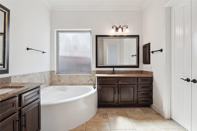 full bathroom with two vanities, crown molding, a garden tub, and a sink