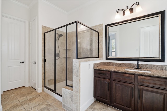 bathroom with a stall shower, ornamental molding, and vanity