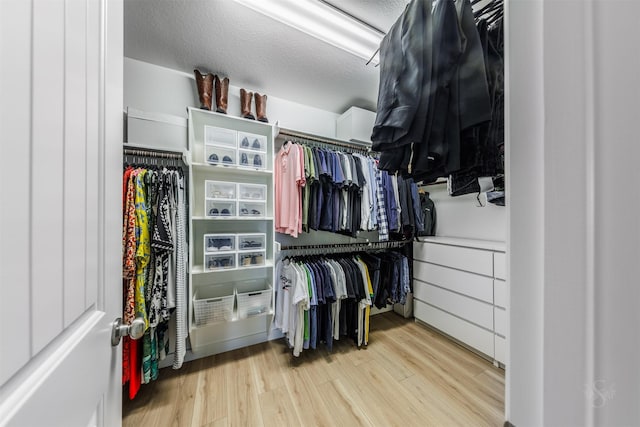 spacious closet with wood finished floors