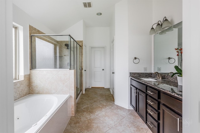 full bath featuring a sink, visible vents, a jetted tub, and a stall shower