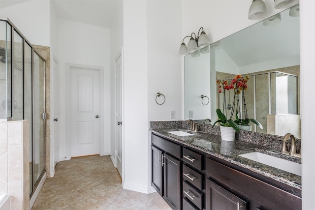 full bathroom with a stall shower and a sink