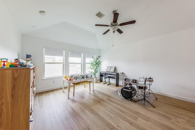 rec room with a ceiling fan, baseboards, visible vents, vaulted ceiling, and light wood-type flooring