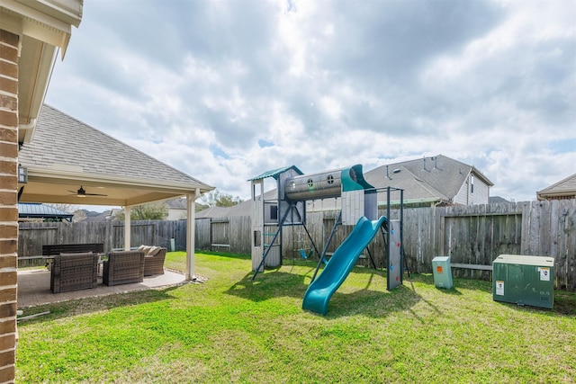 view of yard featuring an outdoor living space, a patio, a fenced backyard, and a playground