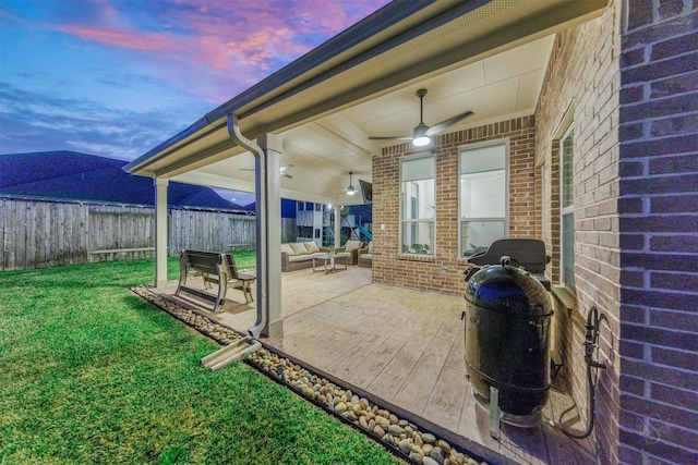 view of patio with outdoor lounge area and fence