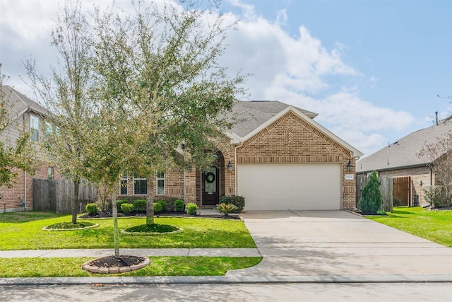 view of front of property featuring brick siding, driveway, an attached garage, and a front lawn