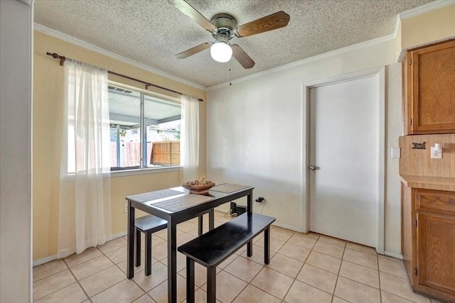 dining room with light tile patterned floors, ceiling fan, and ornamental molding