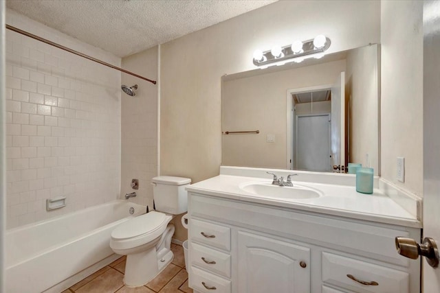 full bathroom featuring toilet, vanity, tile patterned floors, a textured ceiling, and  shower combination