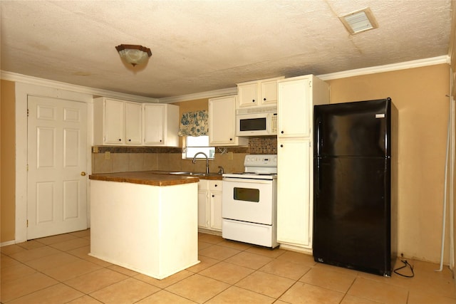 kitchen with visible vents, a sink, white appliances, white cabinets, and crown molding