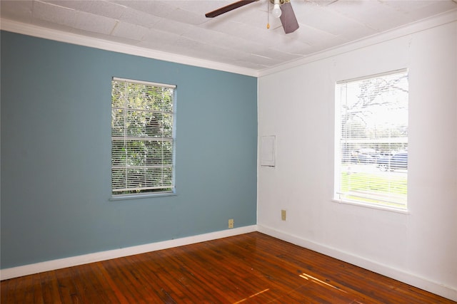 unfurnished room featuring ceiling fan, crown molding, baseboards, and dark wood-style flooring