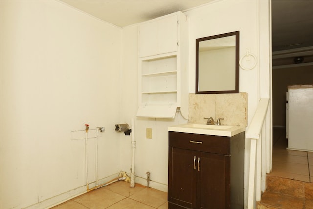 bathroom featuring tile patterned flooring and vanity