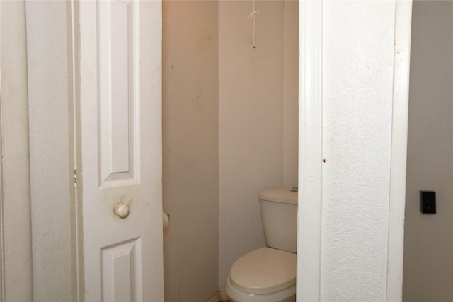 bathroom featuring toilet