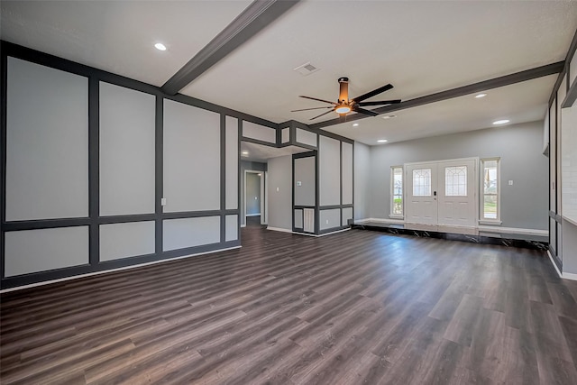 empty room featuring visible vents, baseboards, ceiling fan, beamed ceiling, and dark wood-style floors