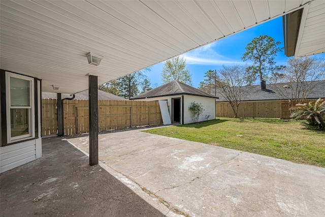 view of patio / terrace featuring an outbuilding and a fenced backyard