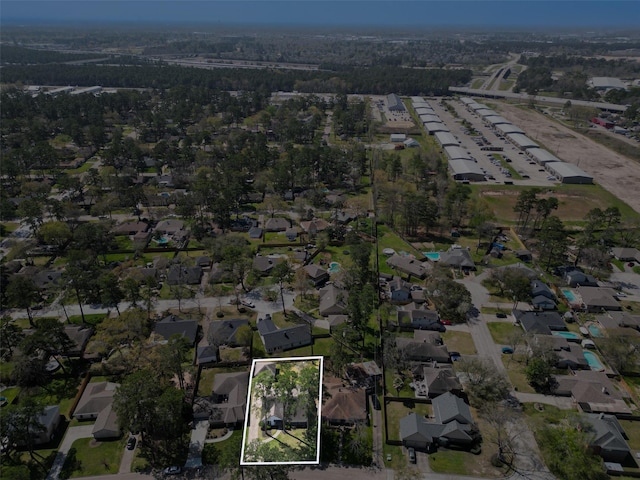 birds eye view of property with a residential view