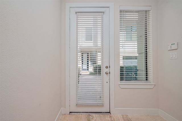 doorway with baseboards