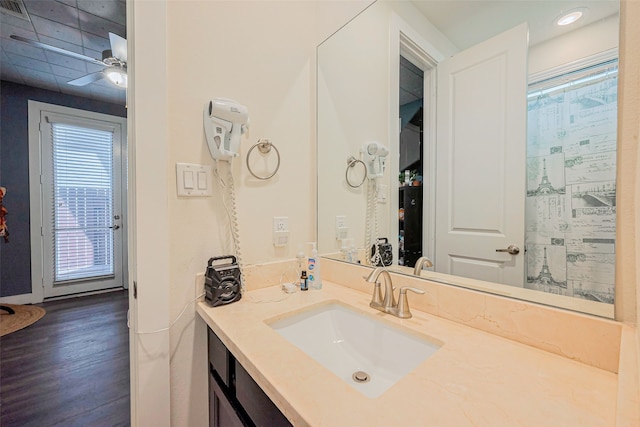 full bath with recessed lighting, vanity, ceiling fan, and wood finished floors