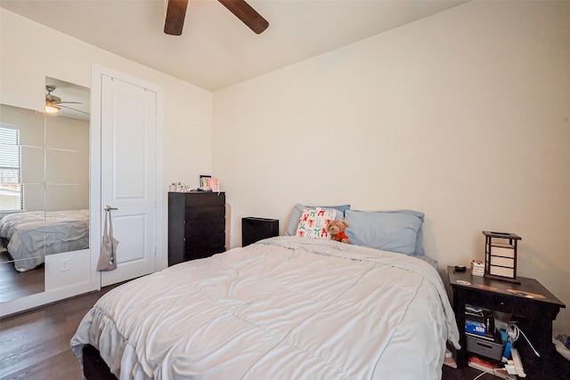 bedroom featuring a ceiling fan and wood finished floors