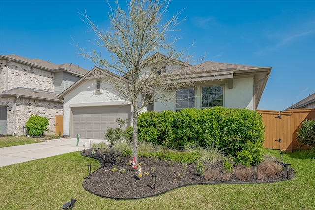 view of front facade with a front yard, roof with shingles, driveway, stucco siding, and a garage