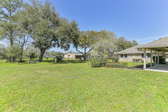 view of yard featuring a patio and fence