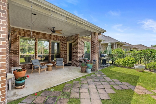 view of patio / terrace with a grill and a ceiling fan