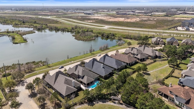 aerial view featuring a residential view and a water view