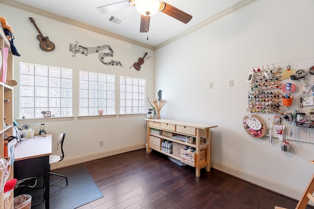 office space with a ceiling fan, wood finished floors, visible vents, baseboards, and crown molding