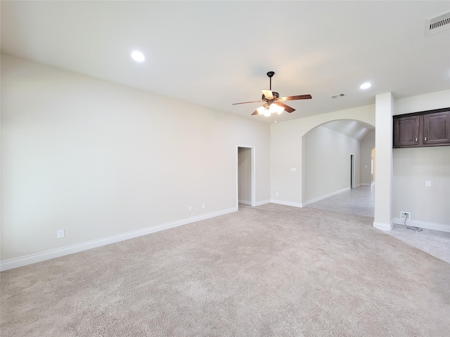 interior space with arched walkways, visible vents, recessed lighting, and ceiling fan