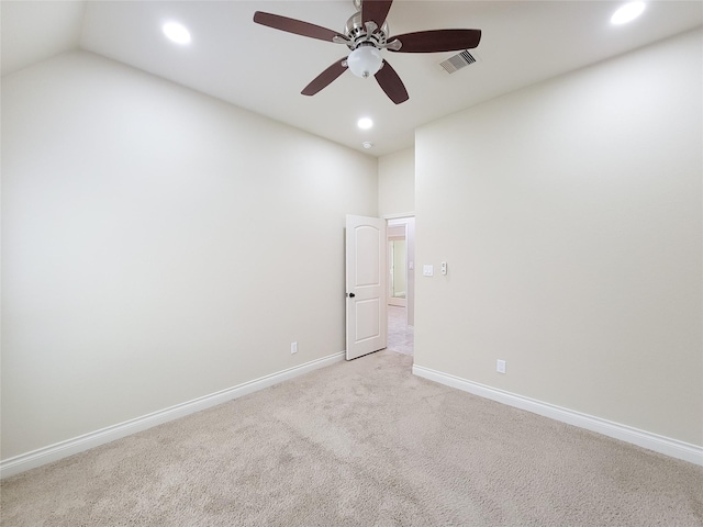 empty room featuring a ceiling fan, baseboards, visible vents, recessed lighting, and light carpet