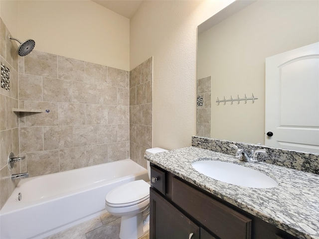 bathroom with tile patterned floors, washtub / shower combination, toilet, and vanity