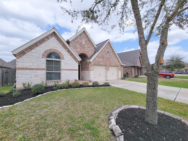 view of front of property with brick siding, driveway, an attached garage, and a front lawn