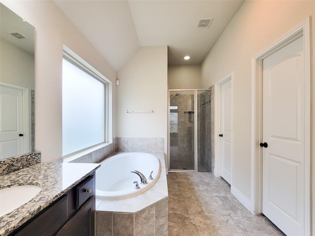 bathroom with vanity, a shower stall, a bath, and visible vents