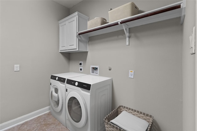 clothes washing area with electric dryer hookup, cabinet space, light tile patterned floors, baseboards, and hookup for a washing machine