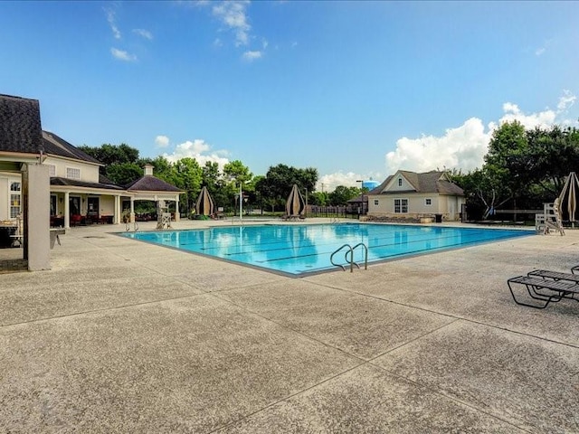 community pool with a patio