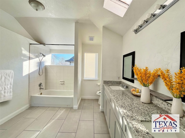 full bathroom with visible vents, a sink, vaulted ceiling, toilet, and shower / bathtub combination