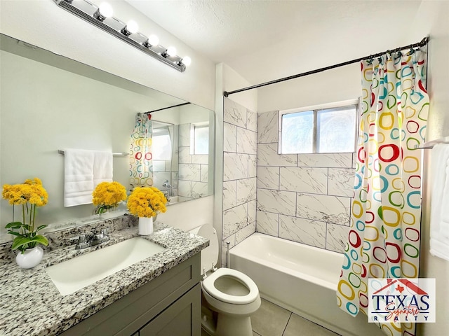 full bathroom with tile patterned floors, toilet, vanity, and shower / bath combo